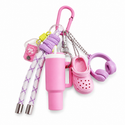 Pink dopamine sports charm keychain on white background
