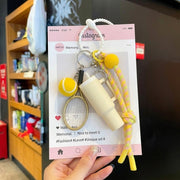 Yellow tennis and tumbler charm gift presentation