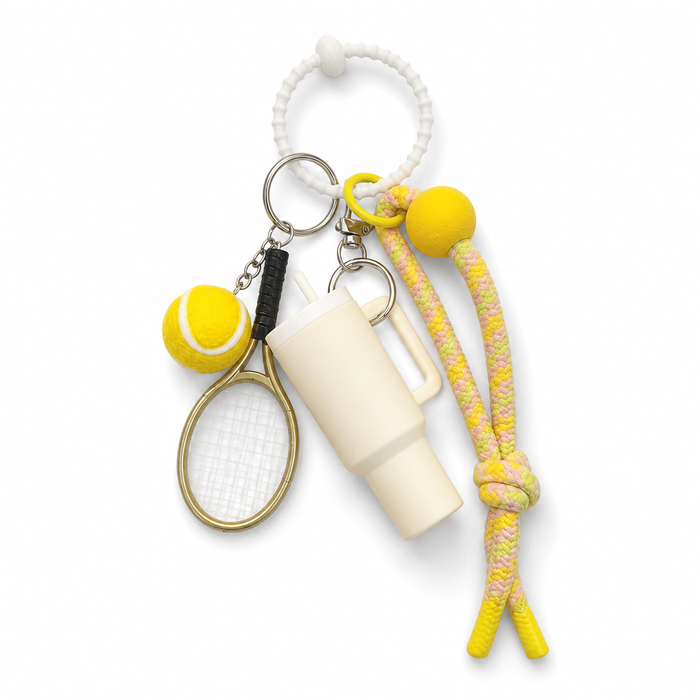Sport tumbler and tennis bag charm on white background